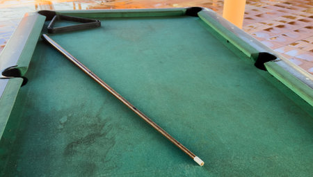 Pool table without balls in the hotel in the open air under a canopy.