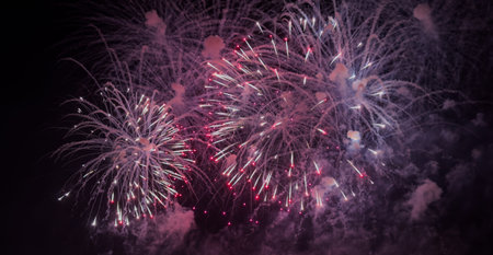 Colorful fireworks over cityscape at new year nightの写真素材