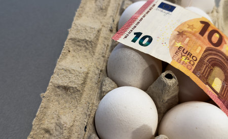 Eggs with bills inside, representing the concept of egg prices and rising food costs.の写真素材