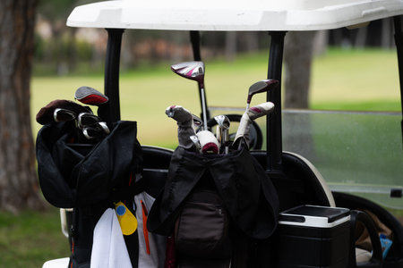 A lot of golf clubs in a cartの写真素材