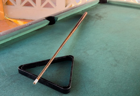 Snooker billiard table, cue on the table, playroom