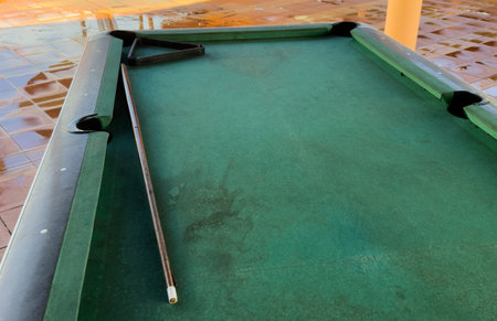 Snooker billiard table, cue on the table, playroom