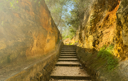 the steep stone stairs leading to the caves and cliffs under the summer sun.