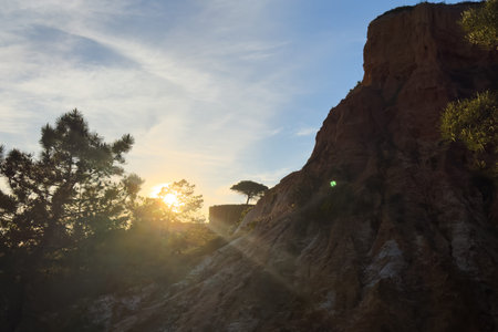 Falesia Beach, Algarve, Portugal. Golden mile beach with orange rocks, golden sand and turquoise...