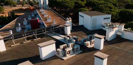 Dual inverter compressor, combination of air conditioner compressor and heating pump, installed on a roof of family house