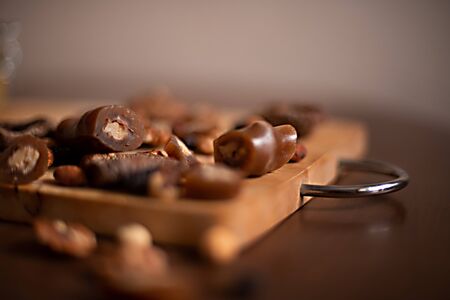 churchhella candy East healthy candies on a wooden Board on the brown wooden table with nuts, figs and raisinsの写真素材