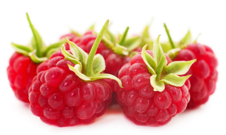 Ripe red raspberries isolated on white background.の写真素材
