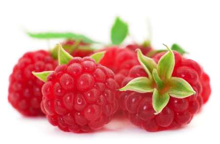 Ripe red raspberries isolated on white background.の写真素材