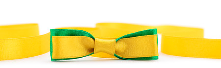Golden ribbon and green border isolated on white backgroundの写真素材