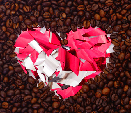Textured background macro of fresh coffee beans in the shape of a heart.の写真素材