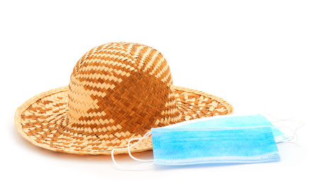 Medical mask, summer hat, virus protection isolated on the white background.の写真素材