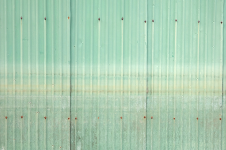 Old green zinc wallの写真素材