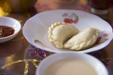 Traditional Tibetan "Momo" dumplings, served in a white plate.の写真素材