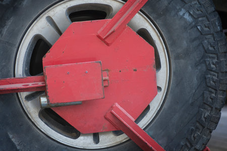Close up of a red Wheel clamp