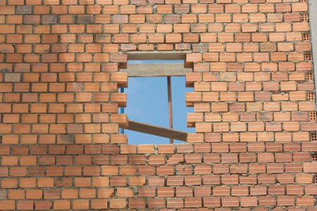 Window through a bricks wallの写真素材