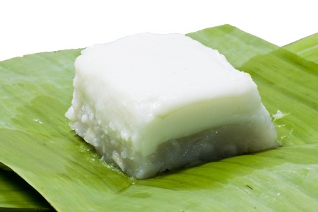 Taro custard topped with coconut layer on banana leafの写真素材