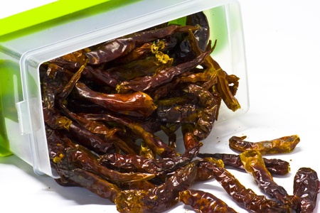 Dried Chili in Semi Transparent box, isolated; pile up, close upの写真素材