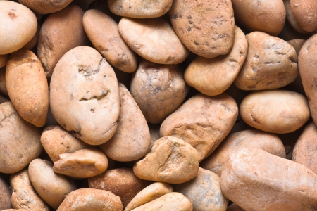 River stone background, earth tone, tile in texture suit for backgroundの写真素材