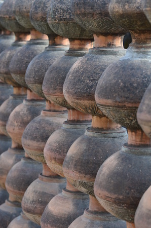 Designer wall made up of clay pots and concrete の写真素材