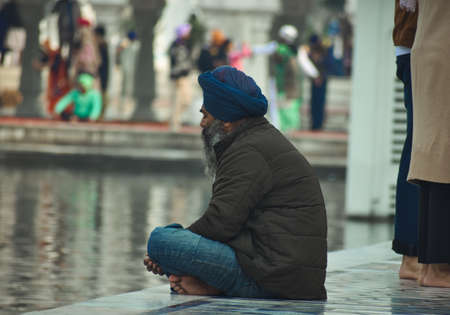 view of a Sikh devotee in the golden temple shri Harmandir Sahib in Amritsar, India