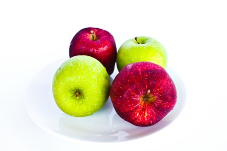 Stock Photo - different concepts - red apple between green applesの写真素材