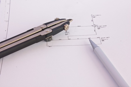 Stock Photo - Electricity diagram (drawing or design) with pen on blueprint