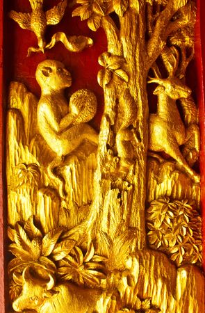 Stock Photo - Door wood carving art Angel, Ancient temple in the South of the country, Thailandの写真素材