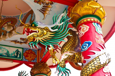 Stock  Photo- Golden Chinese Dragon Wrapped around red poleの写真素材