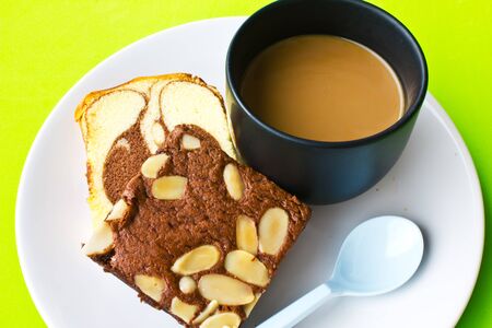 Stock Photo - coffee and banana bread isolated on green backgroundの写真素材