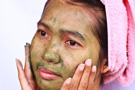 Stock Photo - Spa Mud Mask on the woman's faceの写真素材
