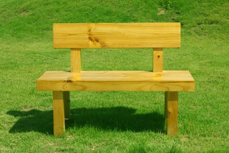 Stock Photo - beautiful wooden garden chair in garden