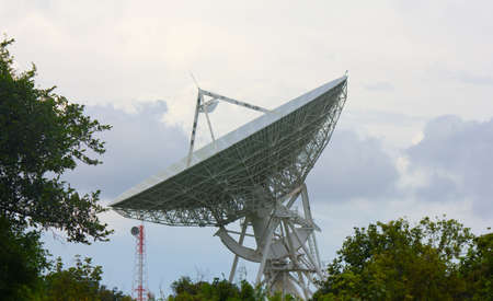 Stock Photo - Telecommunications satellite dish and communications towersの写真素材
