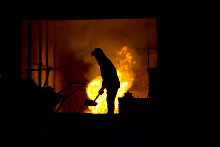 Stock Photo - Hard work in a foundry, melting iron