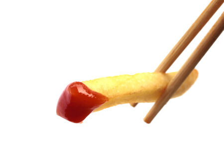 Close up image of dipping fried potato on white background stock photoの写真素材
