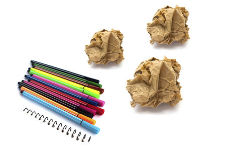 Papers crumple ball and color pen on white background 