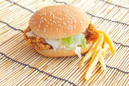 Delicious hamburgers on wood with orange backgroundの写真素材