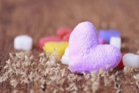 On canvas textile fabric hearts-wood background