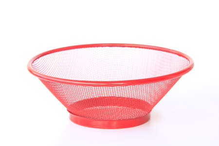 Close-up of steel basket isolated on white backgroundの写真素材