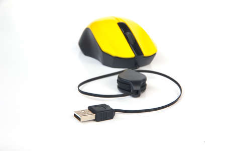 yellow computer mouse with white background.の写真素材