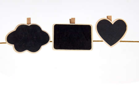 card board hanging on one clothespin, isolated on white.の写真素材