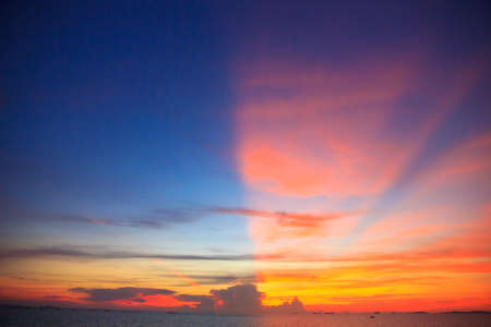 Red sunset dramatic clouds vertical composition for backgroundの写真素材