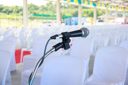 before a conference, the microphones in front of empty chairs.の写真素材