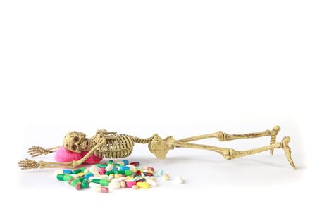 Human skeleton with tablets on white backgroundの写真素材