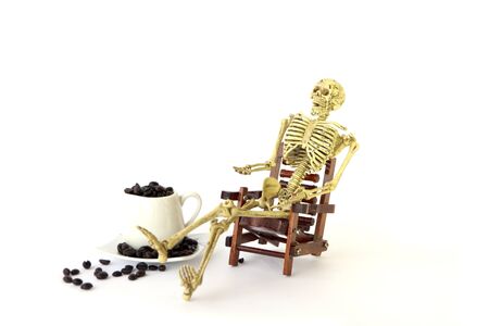 Human skeleton Sit on a chair on white backgroundの写真素材