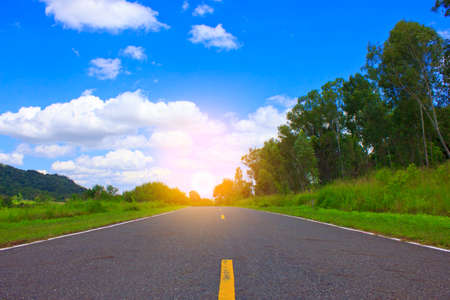 Beautiful countryside road under blue sky Stock Photoの写真素材