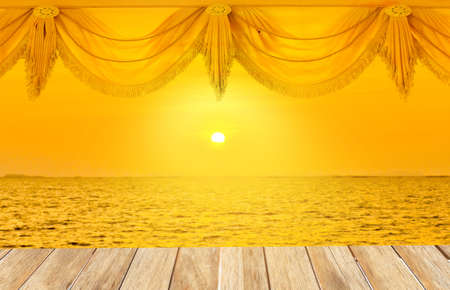 Wooden platform beside tropical sea with sunrise
