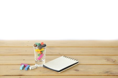 closeup of chalk on wooden table background