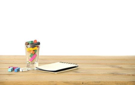 closeup of chalk on wooden table backgroundの写真素材