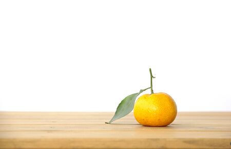 oranges on textured weathered wooden tableの写真素材