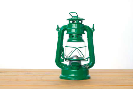 green vintage lamp on wooden table. copy space.の写真素材